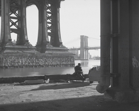 Jed Devine<br /> <em>Two Men Below the Manhattan Bridge,&nbsp;</em><br /> <em>from the FDR Drive, Manhattan, 1994</em><br /> 2 x 6.5", Platinum-palladium print on Japanese rice paper