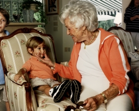 Gillian Laub<br /> <em>Grandma Pinching Nolan's Cheeks, NY, 2005</em><br /> <em>From Family Rename Series, 2007</em><br /> Chromogenic prints<br /> 24 x 20" &nbsp; &nbsp;Edition of 8<br /> 40 x 30" &nbsp; &nbsp;Edition of 5<br /> 50 x 40" &nbsp; &nbsp;Edition of 3