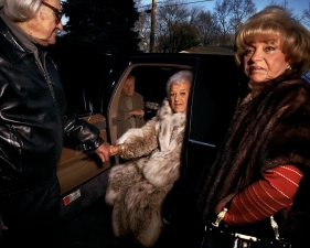 Gillian Laub<br /> <em>Grandpa Helping Grandma, NY, 2000</em><br /> <em>From Family Rename Series, 2007</em><br /> Chromogenic prints<br /> 24 x 20" &nbsp; &nbsp;Edition of 8<br /> 40 x 30" &nbsp; &nbsp;Edition of 5<br /> 50 x 40" &nbsp; &nbsp;Edition of 3