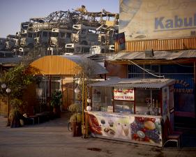 Simon Norfolk<br /> <em>Kabul 'Pizza Express' Restaurant Behind The Municipal Bus Depot, </em>2010<br /> Archival pigment ink prints<br /> 20 x 24" &nbsp; &nbsp;Edition of 7 (plus 2 APs)<br /> 40 x 50" &nbsp; &nbsp;Edition of 7 (plus 2 APs)